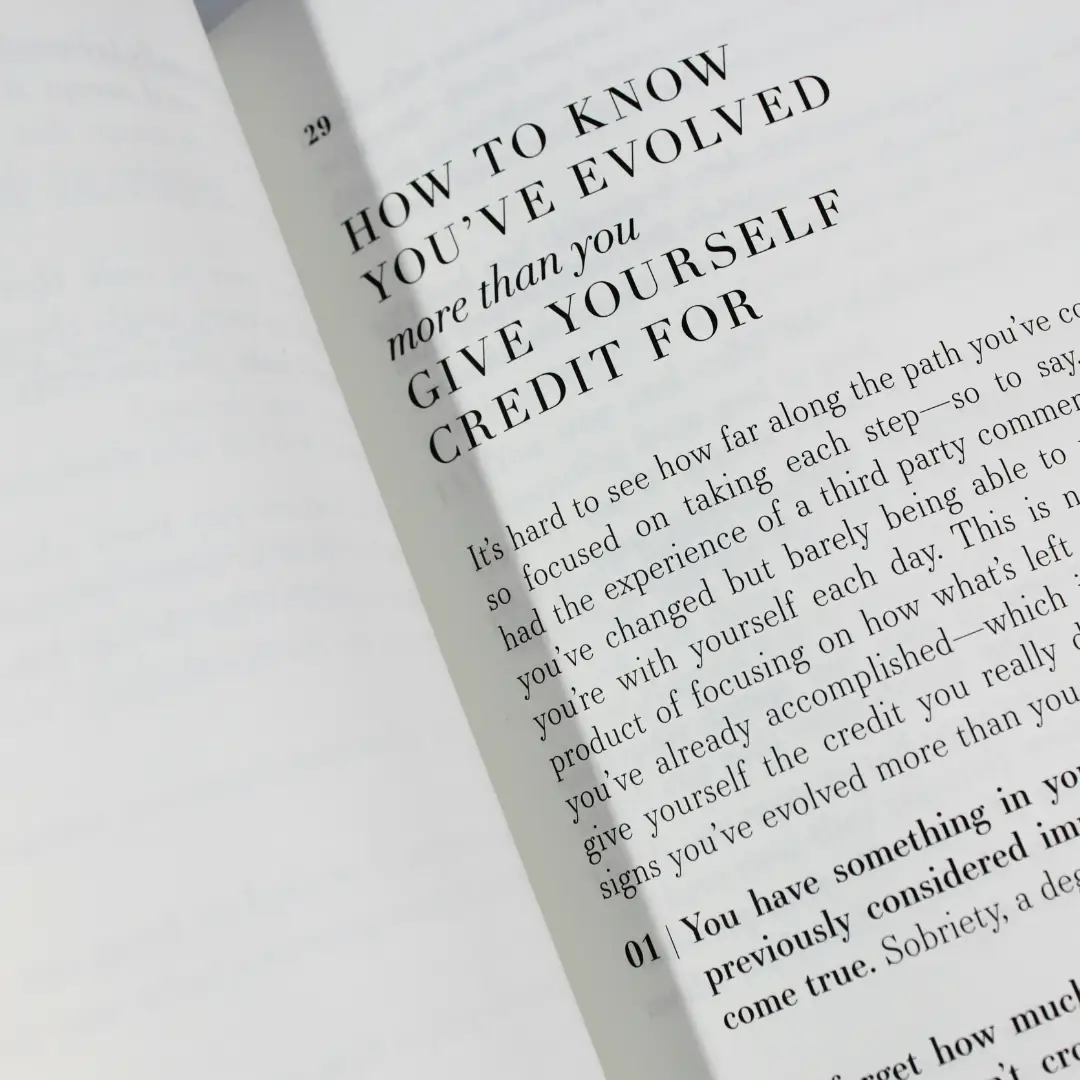 An open book displaying an inspiring passage about self-growth and reflection, symbolizing learning, expression, and the empowering experience of our online English tuition platform.