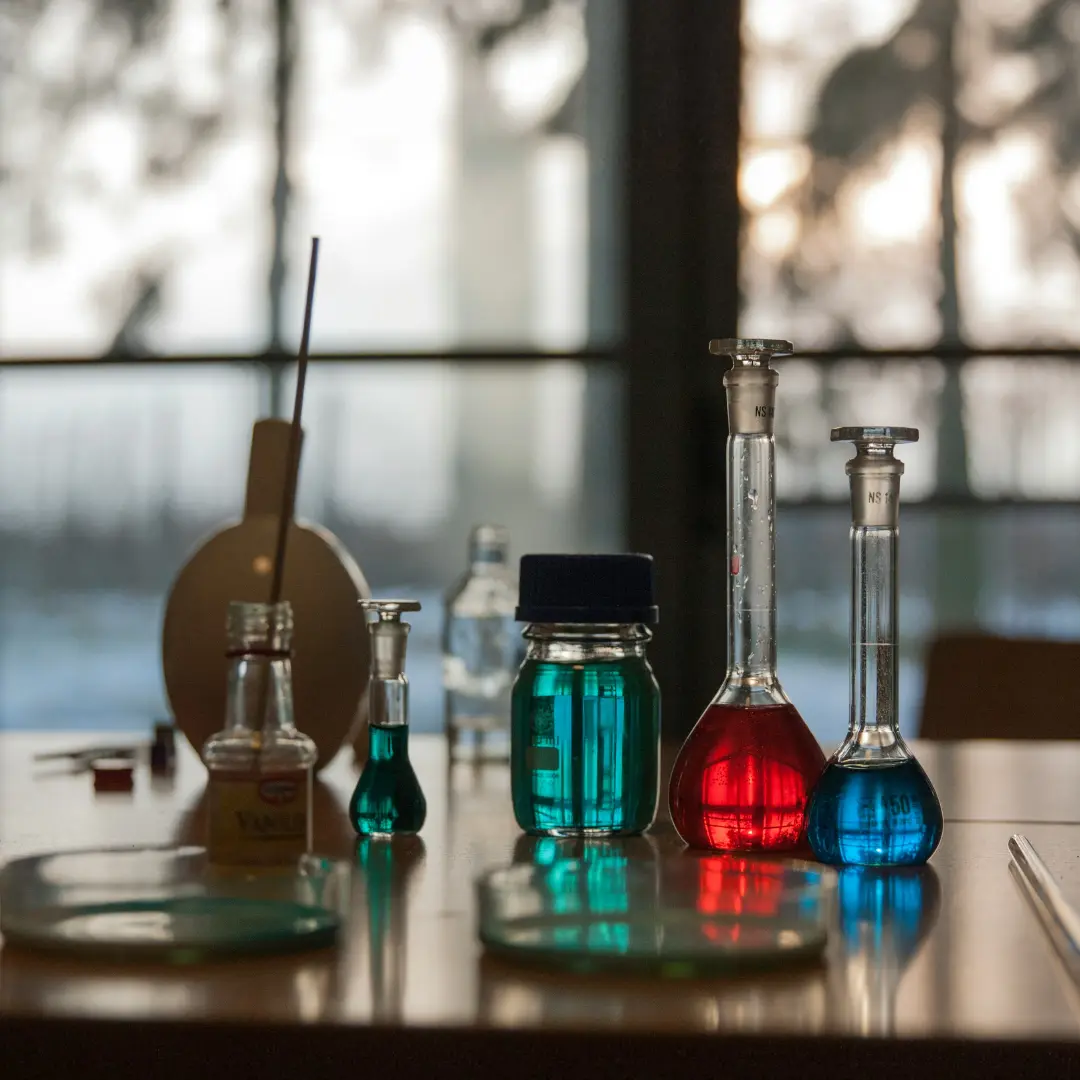 A vibrant science setup with colorful liquids capturing the spirit of curiosity, exploration, and hands-on learning that defines our online tuition experience.